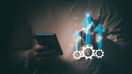 Man shows management progress in the mobile interface to emphasize effective planning, data...