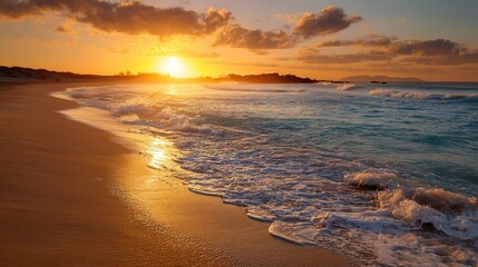 Fototapeta premium Beautiful beach scene with golden sand, crashing waves, sunset sky, blue clouds, and small wave rolling onto shore creating tranquil romantic atmosphere.
