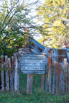 Trespassers will be prosecuted sign on old shed