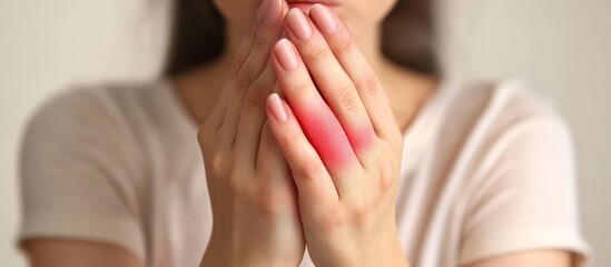 Woman's hand pain, inflammation, indoor, neutral background, medical