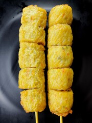 Deep fried chicken meat rolls in plate, in door Chiangmai Thailand.