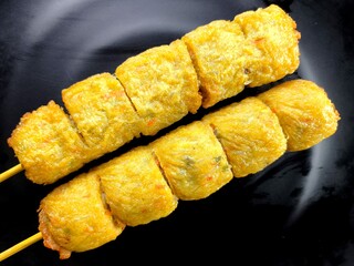 Deep fried chicken meat rolls in plate, in door Chiangmai Thailand.