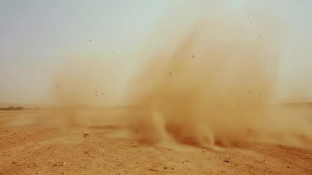Dust Devils Swirl Across Desert Landscape