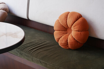 Cozy cafe seating with orange cushions