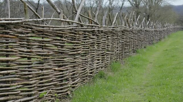 Rustic woven wood fence