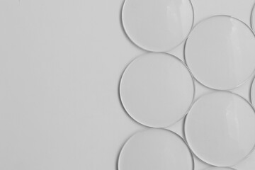 abstract white background, Eyeglasses lens production industry, close-up eyeglasses lenses, glasses lenses, eyeglasses lenses, eyeglasses store business concept