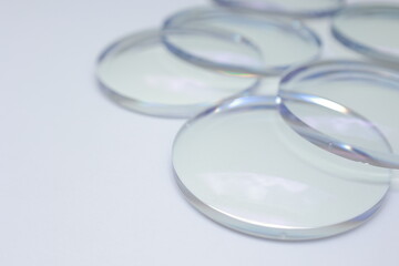 Eyeglasses lens production industry, close-up eyeglasses lenses, Glasses lenses, eyeglass lenses, eyeglasses store business concept, healthy eye care