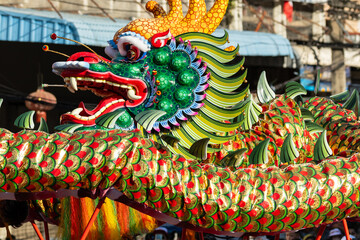 Chinese dragon dance show on street in the Chinese New Year festival.Chinese dragon costume used...