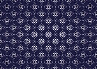 Seamless white floral blooming on dark blue background, ethnic fabric seamless pattern, design for cloth, carpet, batik, wallpaper, wrapping etc.