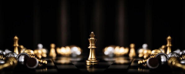 King chess standing for human resources or leadership strategic planning and winner strategy or wining challenge of team player or business teamwork and organization management. © Jintana