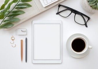 Modern workspace with tablet, coffee, and accessories.