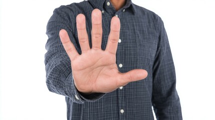 Obraz premium Man with outstretched hand in a stop gesture on a white background.