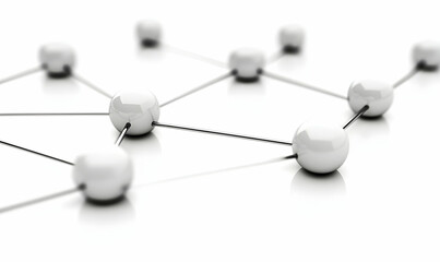 Network of interconnected white spheres on a reflective surface with shallow depth of field