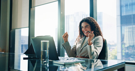 Fototapeta na wymiar Happy woman, laptop and winning with fist pump at office for increase, investment or profit. Excited, female person or employee with smile on computer for good news, promotion or bonus at workplace