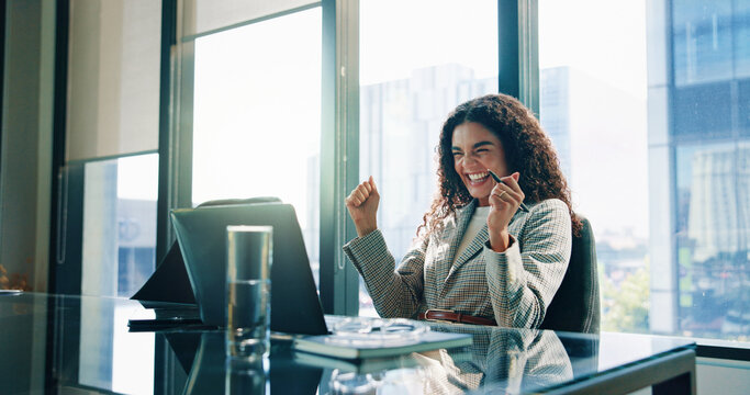 Happy woman, laptop and winning with fist pump at office for increase, investment or profit. Excited, female person or employee with smile on computer for good news, promotion or bonus at workplace