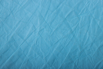 Abstract wrinkled blue crumpled paper texture background