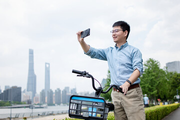 asian man selfie in city