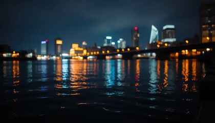Fototapeta premium Nighttime cityscape reflecting on a calm river