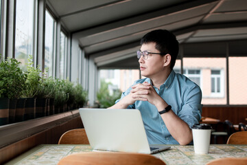 asian businessman working on laptop