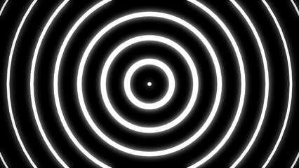 Abstract black and white circular pattern featuring concentric rings creates a visual effect of expanding energy and dynamic movement.