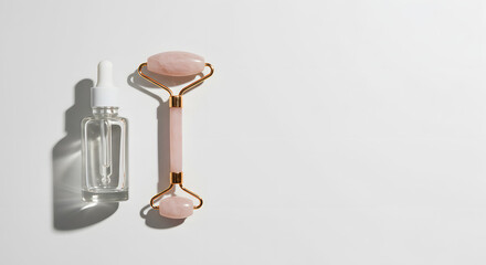 Rose Quartz Facial Roller and Serum Bottle on White Background
