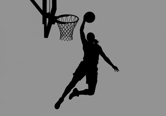 Silhouette of a basketball player dunking a ball into a basketball hoop against a gray background
