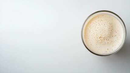 Overhead View of Frothy Drink in Glass with Copy Space drink glass frothy overhead beverage foam tea