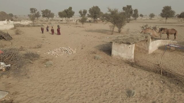 people of Cholistan, Punjab, Pakistan bringing water from well for their home necessities 