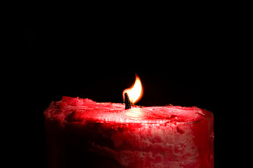 Burning Candle in the Darkness
