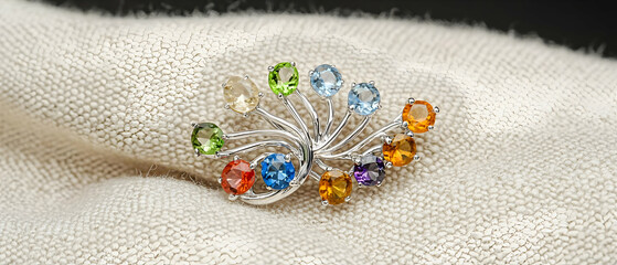 Multicolored Gemstone Peacock Brooch On Knitted Fabric