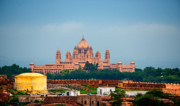 Woman tourist in front of Umaid Bhawan palace, Jodhpur, India
