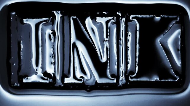 The word INK with flowing black ink