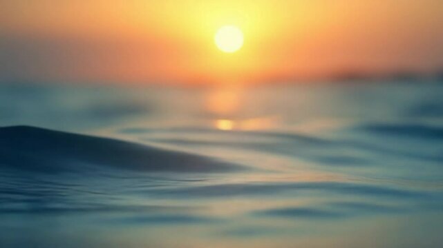 Abstract sea summer ocean sunset nature background. Small waves on water surface in motion blur with golden bokeh lights from sun. Holiday, vacation and recreational concept. Slow motion