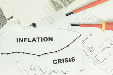 Electrical components, work tools, installation plan, currencies Dollar, inscriptions inflation and crisis. High prices of building or renovation home