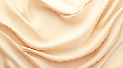 Obraz premium Luxurious peachy-beige fabric draped in soft folds.
