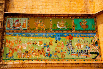 Colorful Indian mural painting outside on Mehrangarh Fort, Jodhpur, India. © CRSHELARE
