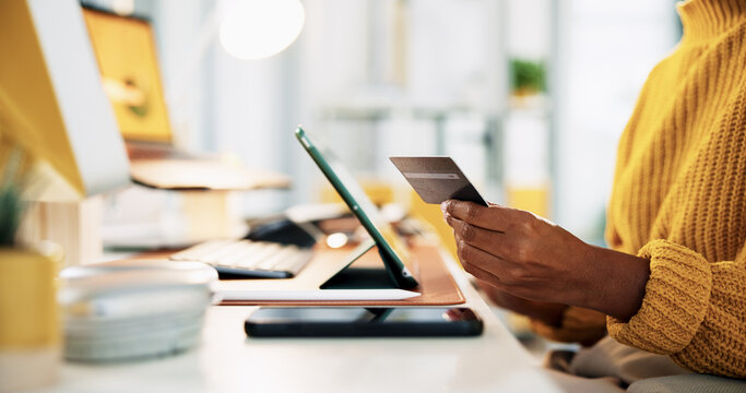 Office, hands and person with tablet for credit card, software payment and online shopping. Closeup, businesswoman and creative manager with debit for seo platform, application purchase and ecommerce