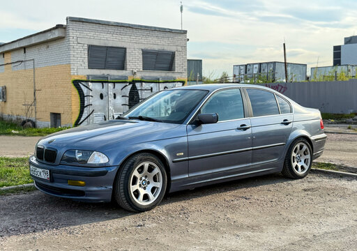 BMW 3 series e46 in a parking lot. Motor car BMW E46 3-series parked on street. Exterior of a fourth generation of the BMW 3 Series (E46) blue color. Germany car. 
