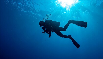 Silhouette of a Scuba Diver Exploring the Deep Ocean