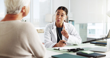 Obraz premium Senior woman, doctor and consultation for prescription instruction, referral letter and healthcare report. Medical professional, appointment and talking to patient for help or checkup in hospital