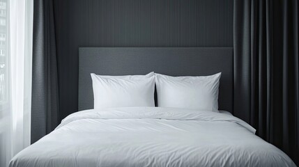 Modern bed with grey headboard and white sheet