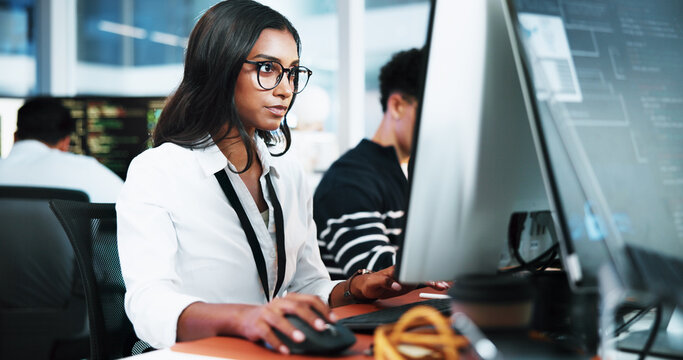 Woman, developer and typing on computer in office for programming, software update and troubleshooting. Person, pc and coding for website development, testing server and monitor of system application