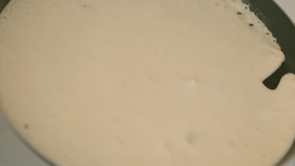 A Smooth Dark Plate with a Unique Surface Texture Designed for Culinary Use and Display