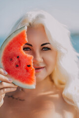Watermelon Woman Summer Beach: Portrait of a blonde woman holding a watermelon slice near the...