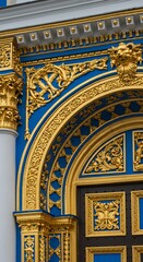 Obraz premium Ornate gold decoration on blue architectural detail