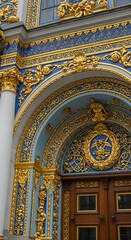 Obraz premium Ornate Blue and Gold Architectural Detail on Building Facade