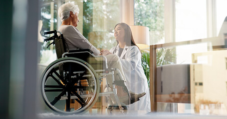 Women, caregiver and senior patient in wheelchair at retirement home for healthcare, support and...