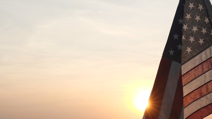 Memorial Day USA. Remember and Honor. Silhouettes of American flag waving on background of beautiful sunset or sunrise for honoring, mourning USA military. Memorial Day, Happy Holiday American Concept