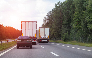 a column of trucks on the road carrying cargo. Concert of cakes and banditry on the roads, copy...