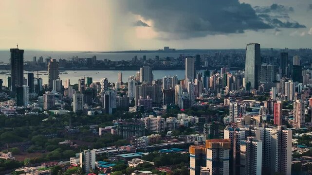 Modern City high-rise skyscraper buildings. Aerial drone view of the Financial District in Mumbai. Beautiful cloudy weather during the monsoon season in Mumbai, India. Lalbag-Parel view.